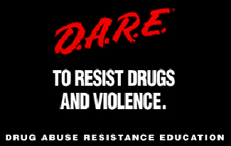 A D.A.R.E. poster reads “D.A.R.E. to resist drugs and violence.”